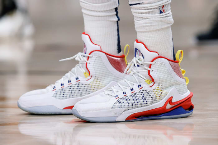 View of Nikola Jokic's white, red, and blue Nike shoes.